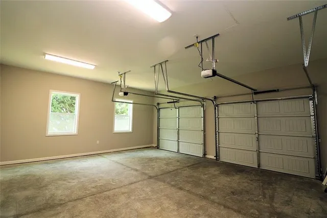 a view of a balcony with wooden floor and fence