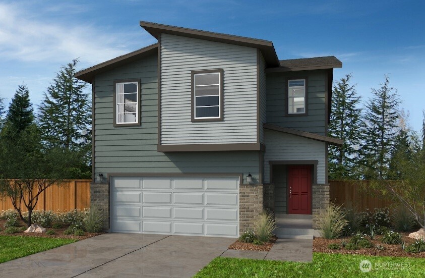 24220 13 Avenue Southeast, Unit CR02 Bothell, WA 98021 - Photo 1 of 4 a front view of a house with a yard and garage