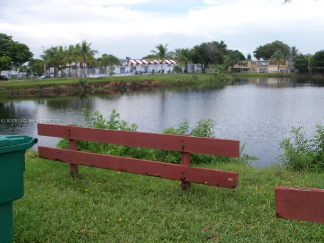 a view of a lake with a garden and lake view