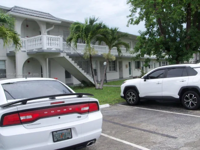 a view of a car parked in front of a house