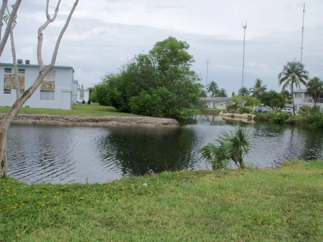 a view of a lake with a building in the background