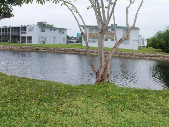 a view of a lake with a building in the background