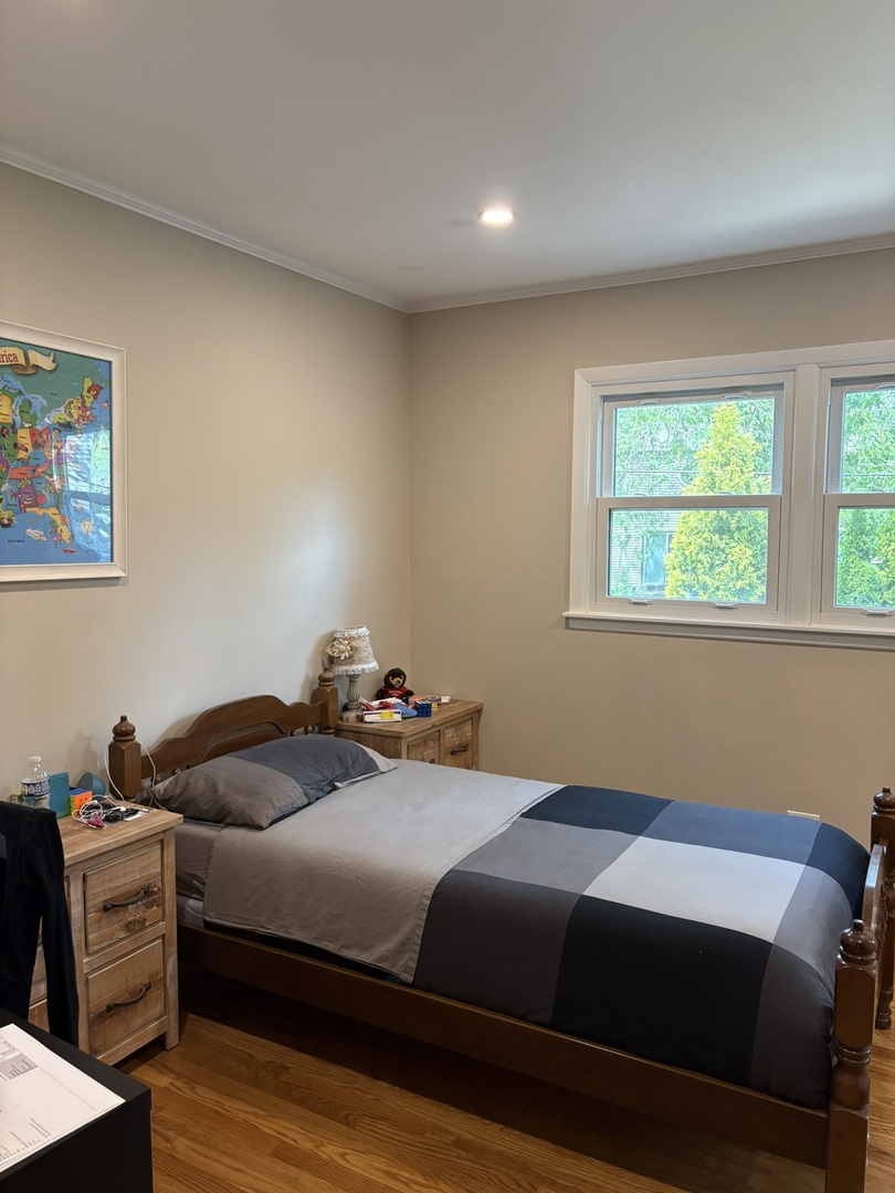 609 West Gartner Road Naperville, IL 60540 - Photo 9 of 23 a bedroom with a bed and a window
