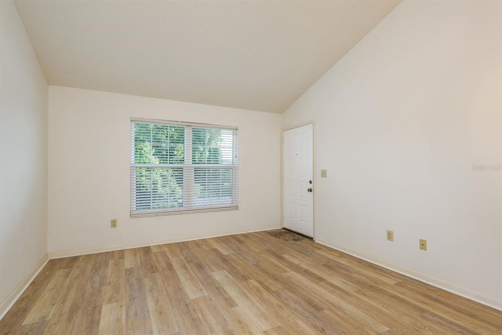 6410 Spring Flower Drive, Unit 26 New Port Richey, FL 34653 - Photo 17 of 38 an empty room with a window