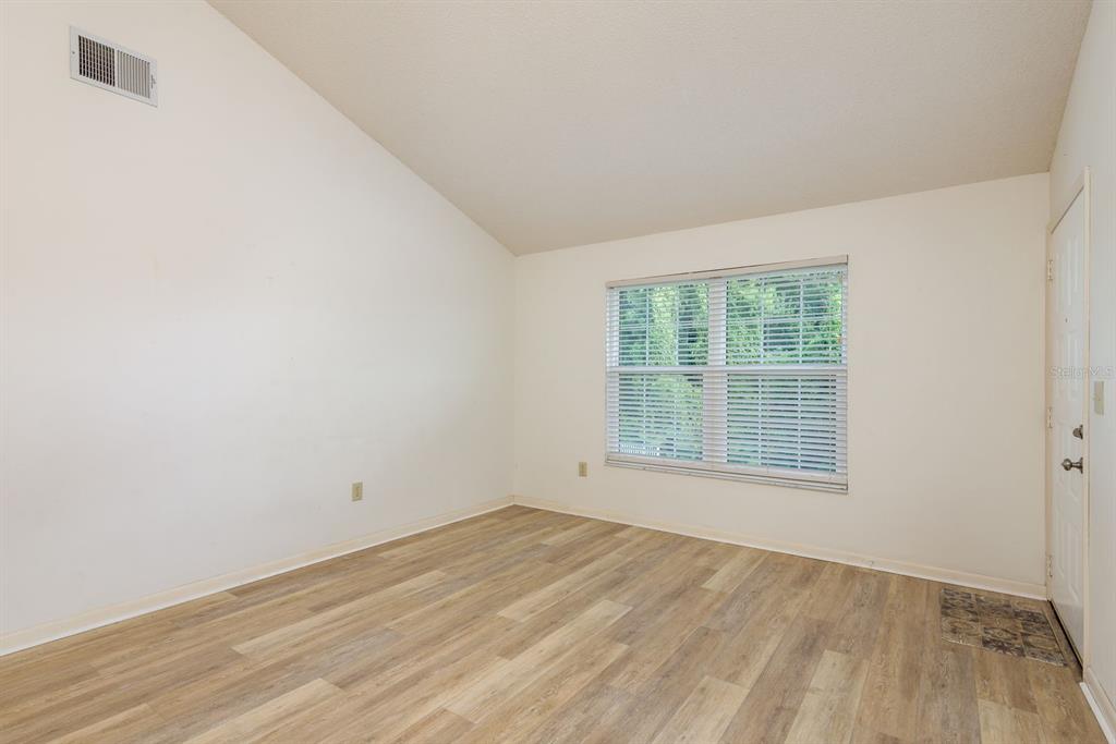 6410 Spring Flower Drive, Unit 26 New Port Richey, FL 34653 - Photo 18 of 38 an empty room with a window