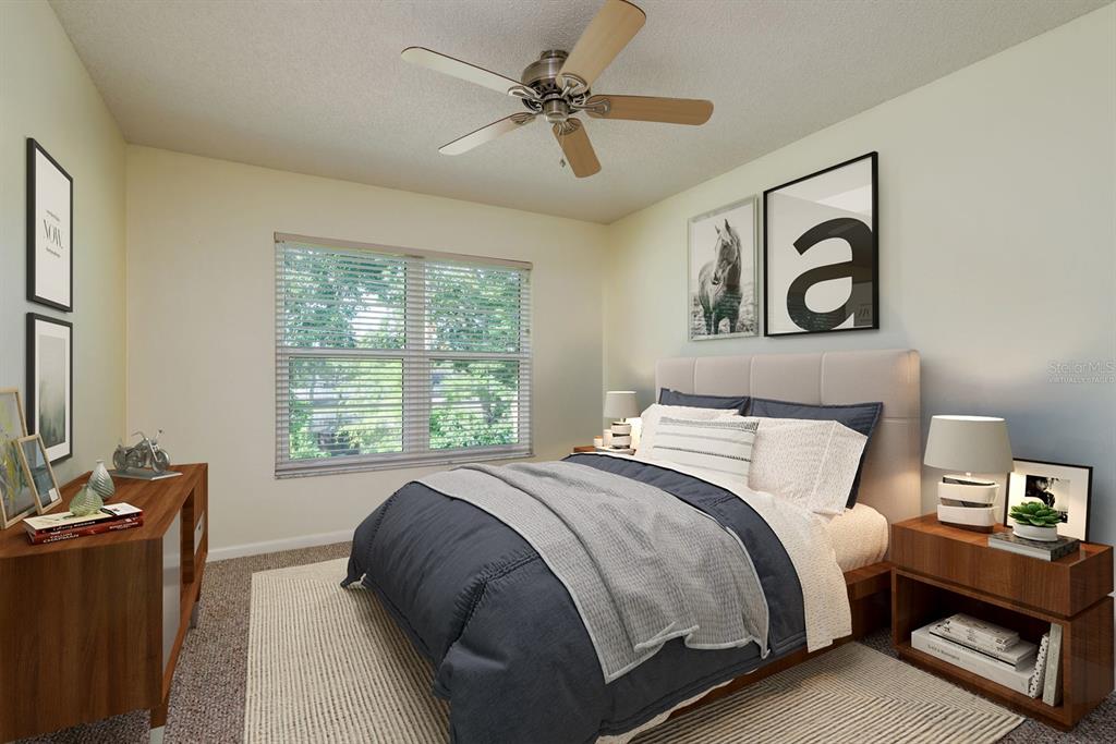 6410 Spring Flower Drive, Unit 26 New Port Richey, FL 34653 - Photo 2 of 38 a bedroom with a bed and a window