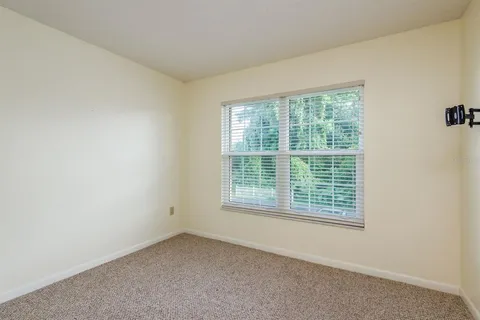 a view of a balcony with wooden floor