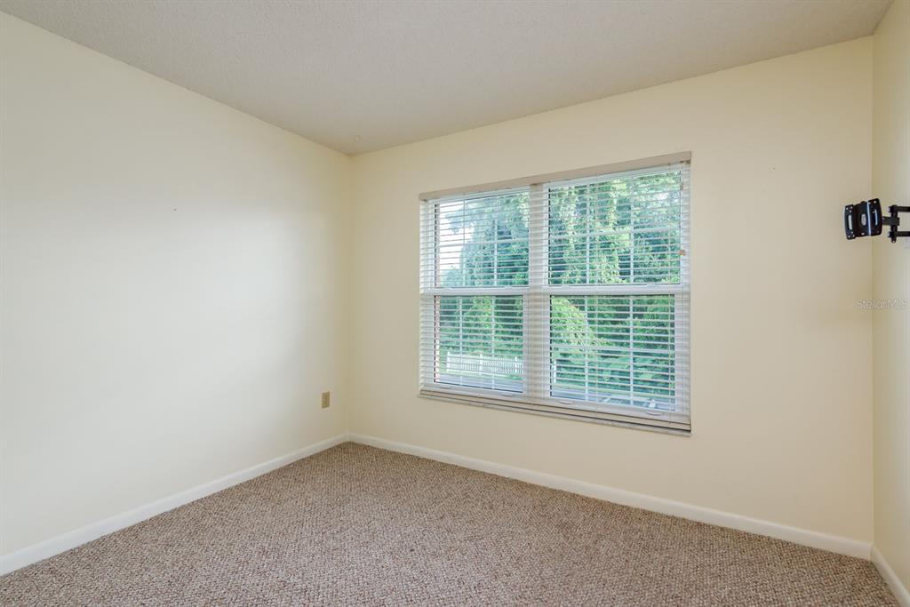 6410 Spring Flower Drive, Unit 26 New Port Richey, FL 34653 - Photo 23 of 38 an empty room with a window