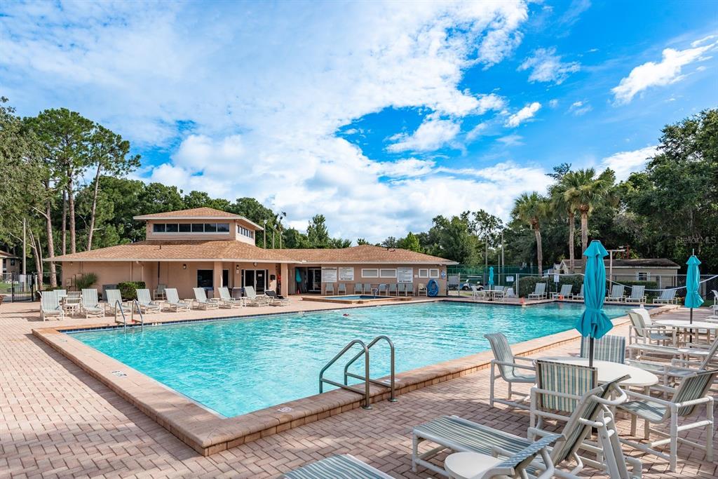 6410 Spring Flower Drive, Unit 26 New Port Richey, FL 34653 - Photo 29 of 38 an aerial view of a house with swimming pool garden and patio