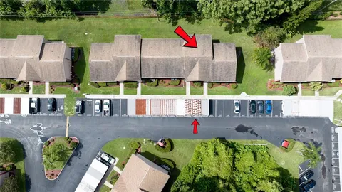 an aerial view of residential house with outdoor space and trees