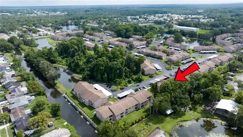 an aerial view of residential houses with outdoor space and street view