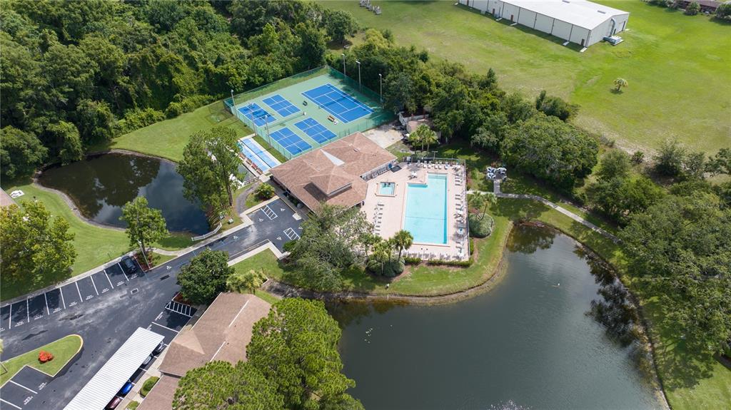 6410 Spring Flower Drive, Unit 26 New Port Richey, FL 34653 - Photo 37 of 38 an aerial view of a house with a garden and swimming pool
