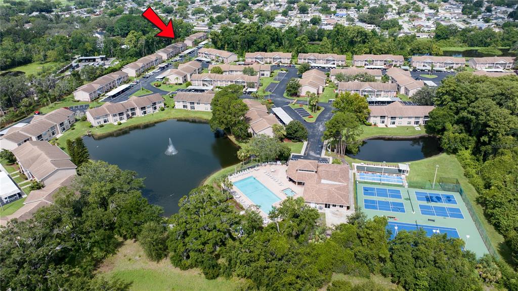 6410 Spring Flower Drive, Unit 26 New Port Richey, FL 34653 - Photo 38 of 38 an aerial view of residential houses with outdoor space and street view