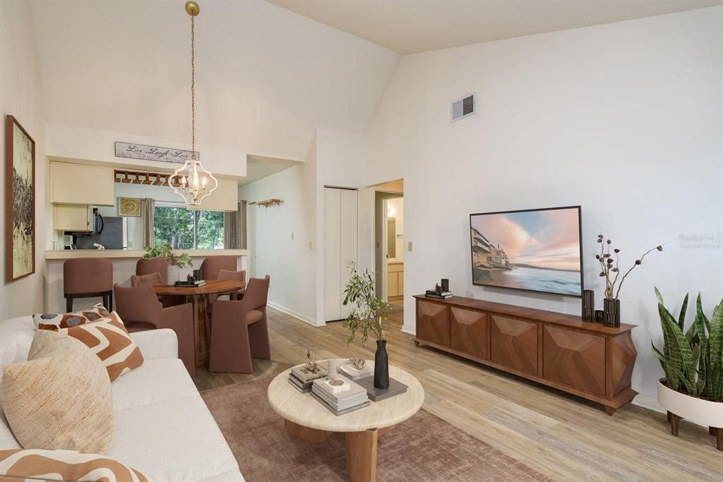 6410 Spring Flower Drive, Unit 26 New Port Richey, FL 34653 - Photo 4 of 38 a living room with furniture and a wooden floor