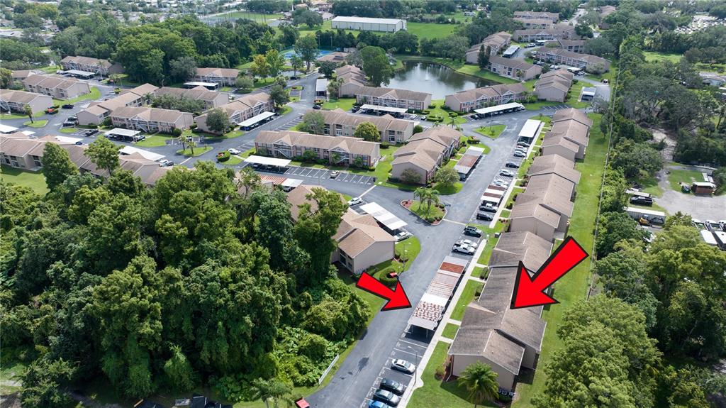 6410 Spring Flower Drive, Unit 26 New Port Richey, FL 34653 - Photo 8 of 38 an aerial view of residential house with outdoor space and swimming pool