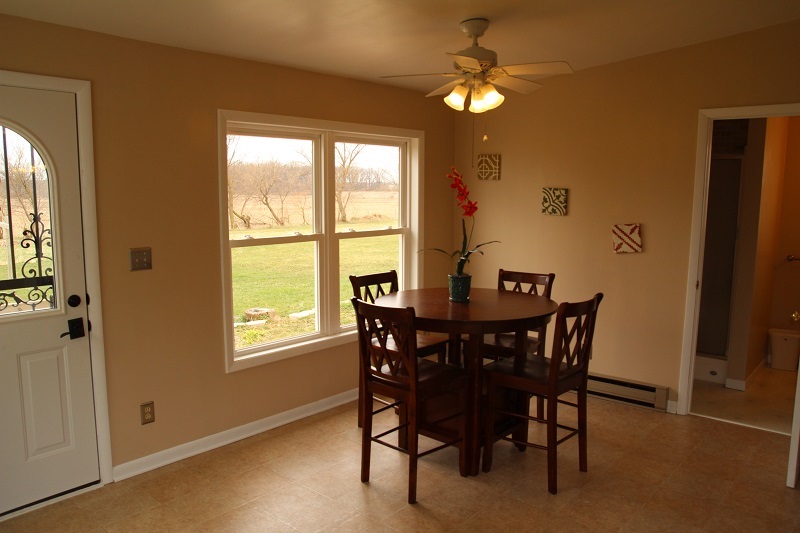 7685 Edson Road Capron, IL 61012 - Photo 2 of 23 a view of a dining room with furniture and a chandelier
