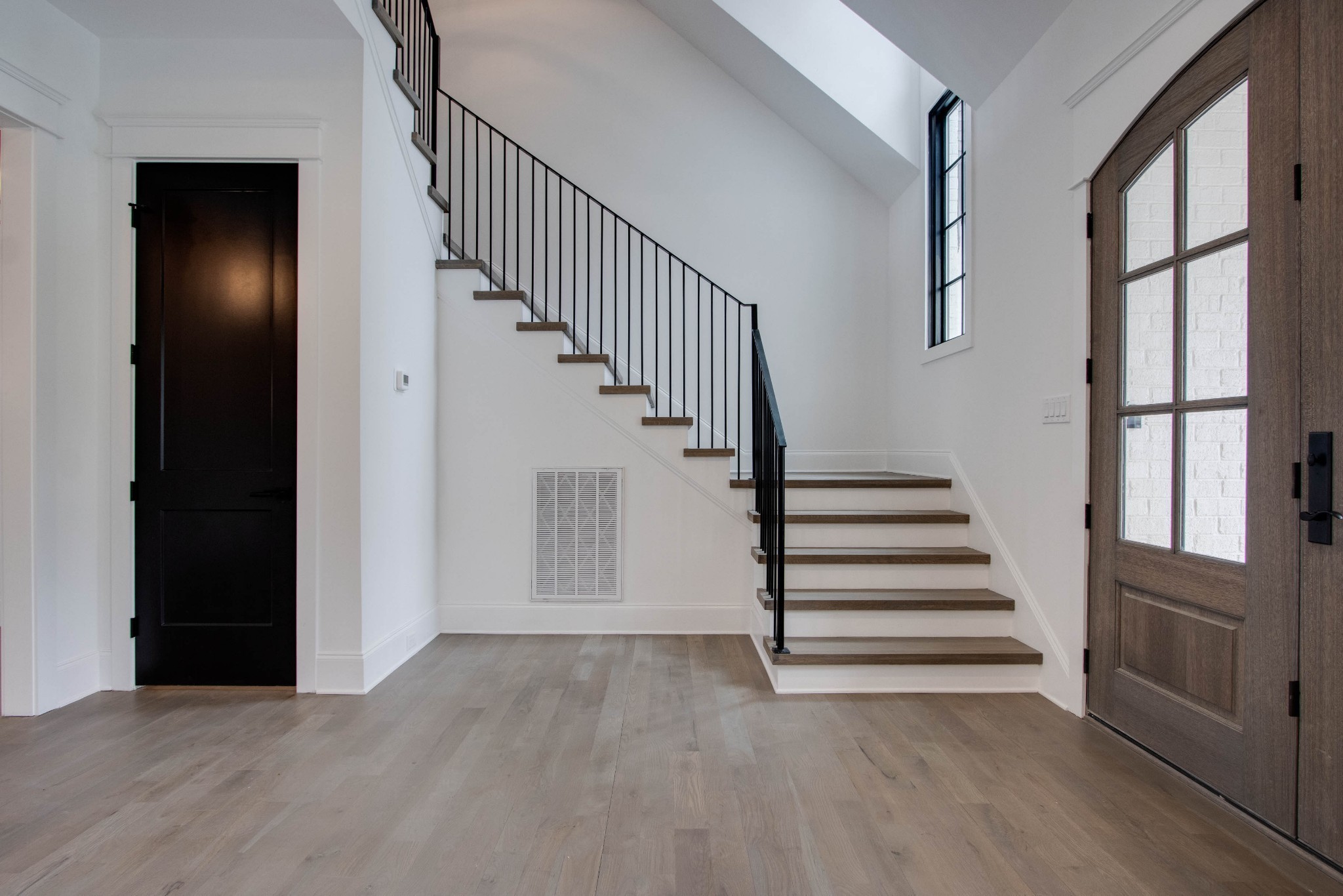 1300 Harding Place Nashville, TN 37215 - Photo 11 of 68 a view of entryway with wooden floor and stairs