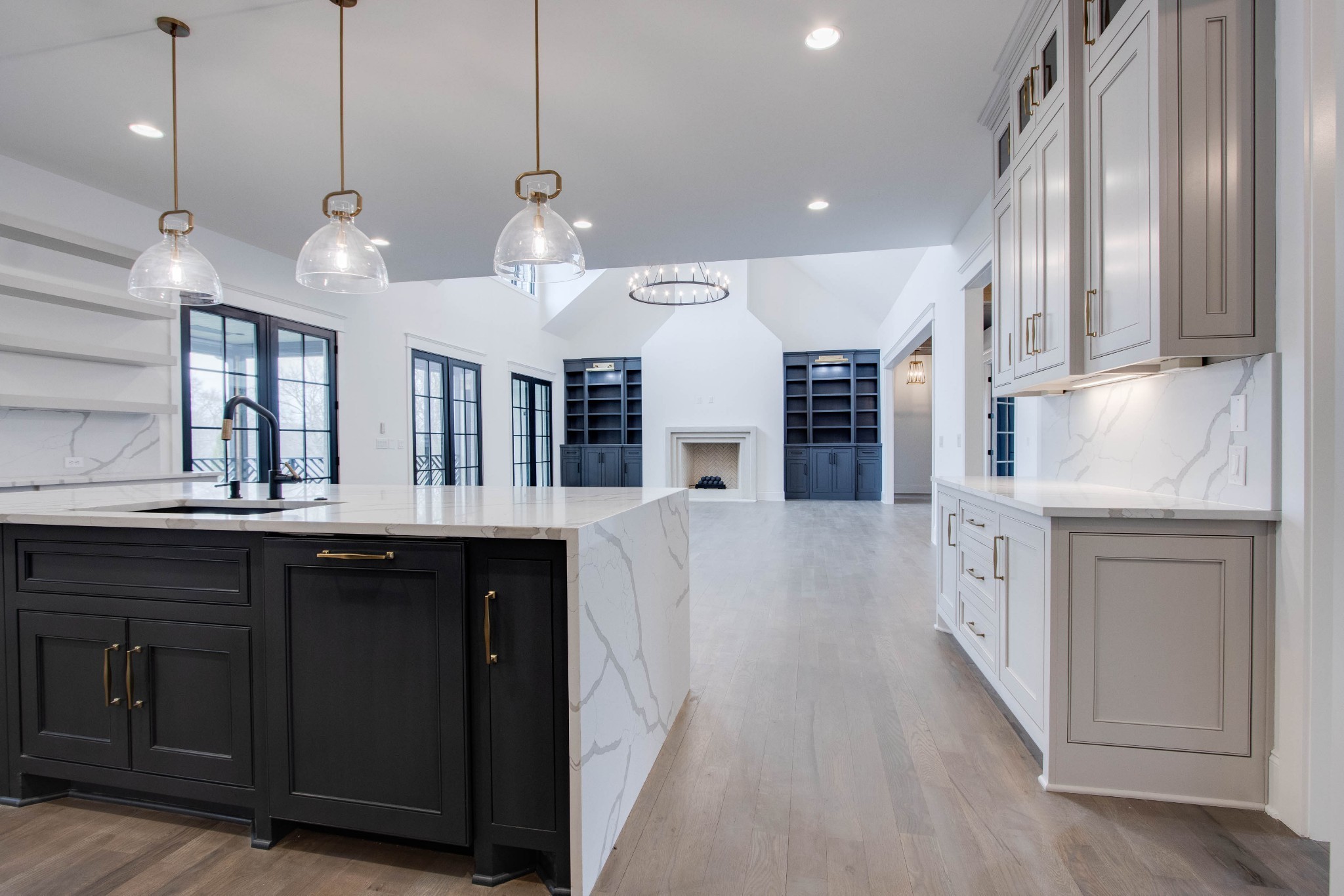 1300 Harding Place Nashville, TN 37215 - Photo 19 of 68 a large kitchen with granite countertop a large kitchen island white cabinets and stainless steel appliances