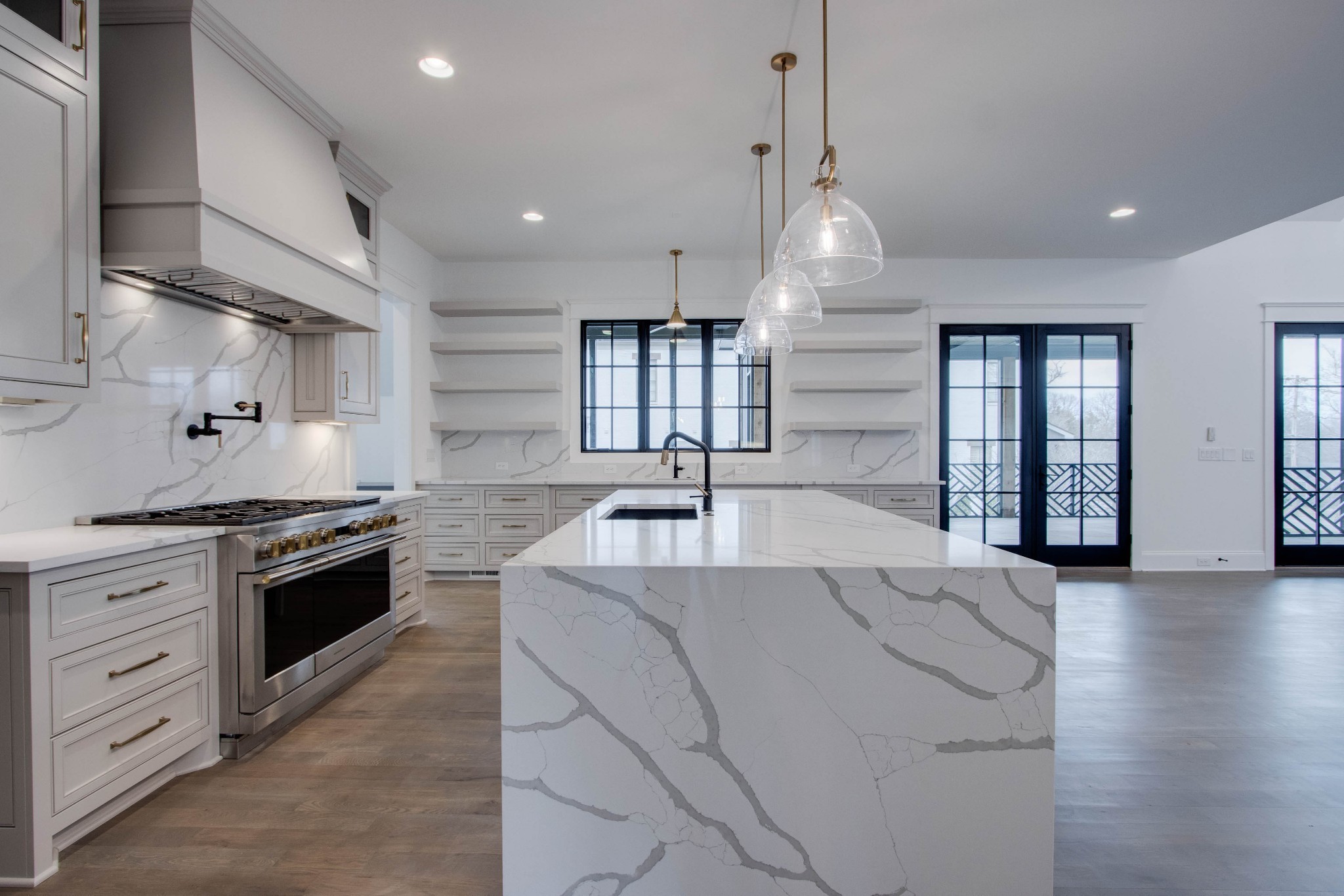 1300 Harding Place Nashville, TN 37215 - Photo 20 of 68 a large kitchen with stainless steel appliances granite countertop a stove a sink dishwasher and a oven with white cabinets