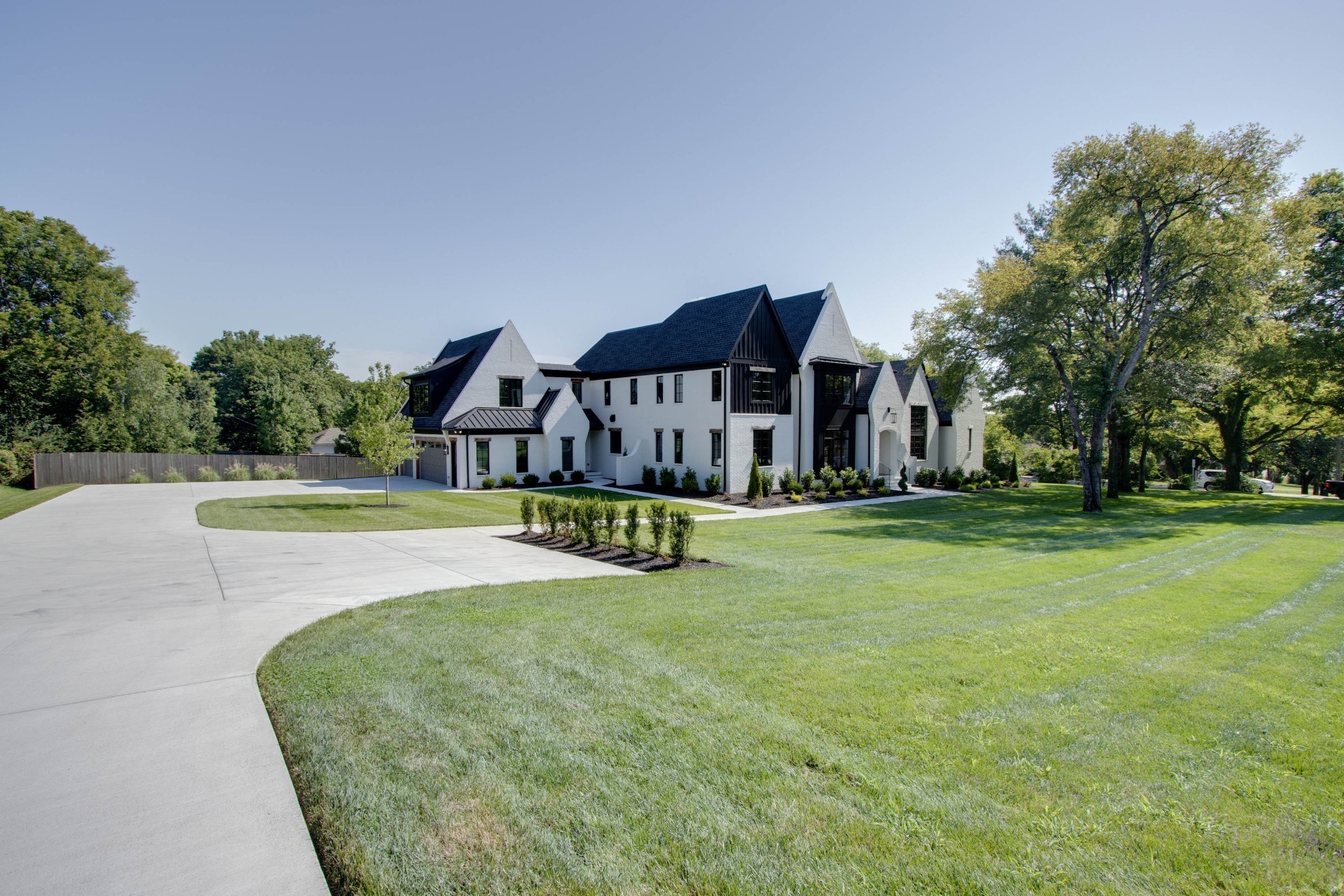 1300 Harding Place Nashville, TN 37215 - Photo 2 of 68 a view of a house with swimming pool and yard