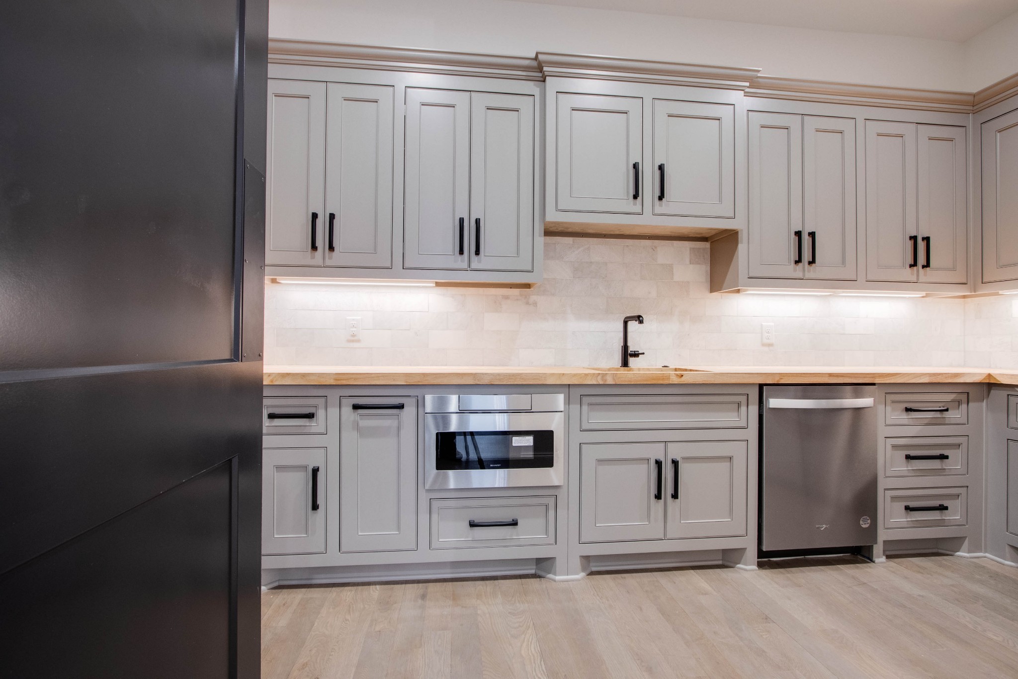 1300 Harding Place Nashville, TN 37215 - Photo 22 of 68 a kitchen with stainless steel appliances granite countertop a sink and cabinets with wooden floor