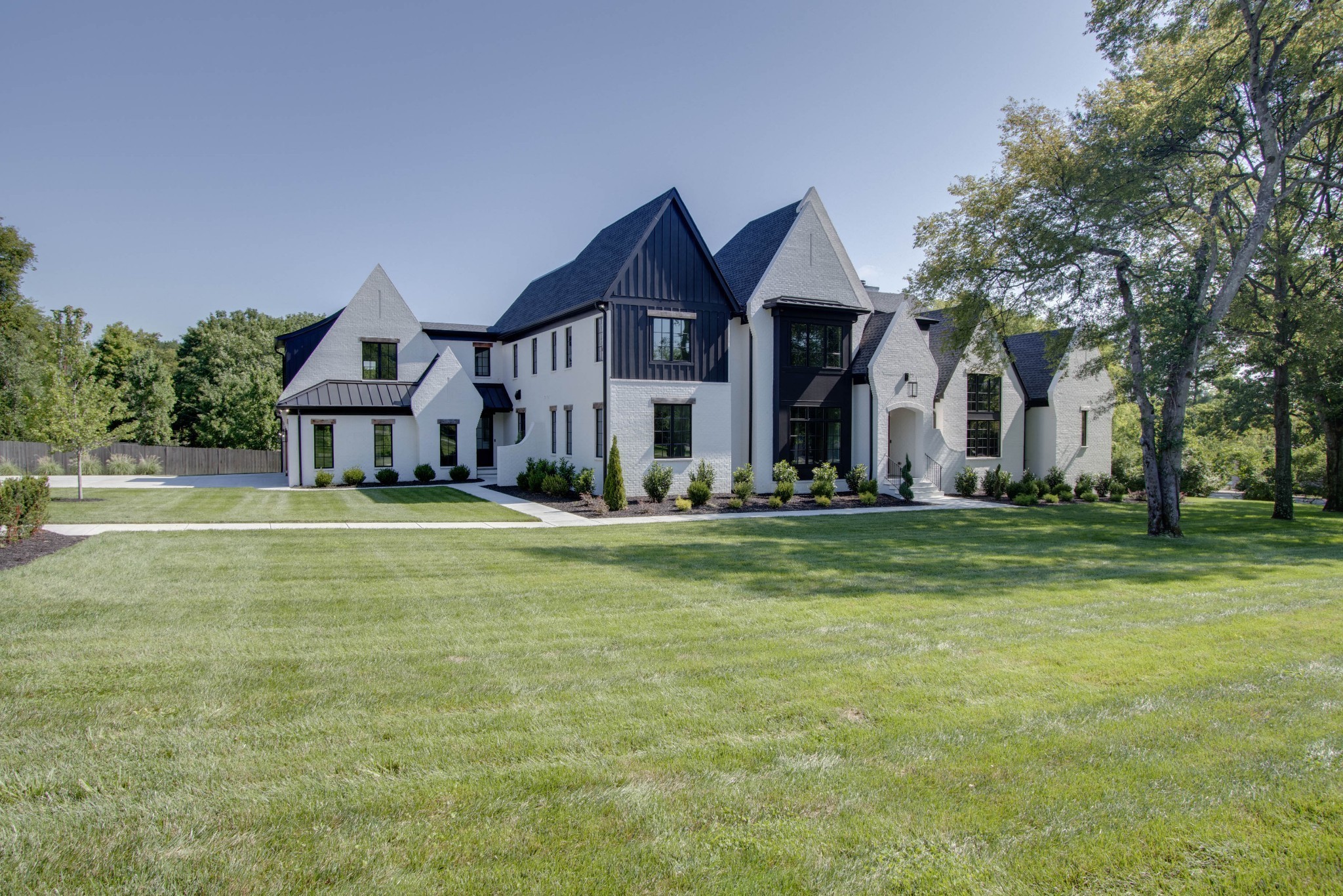 1300 Harding Place Nashville, TN 37215 - Photo 4 of 68 a front view of a house with swimming pool