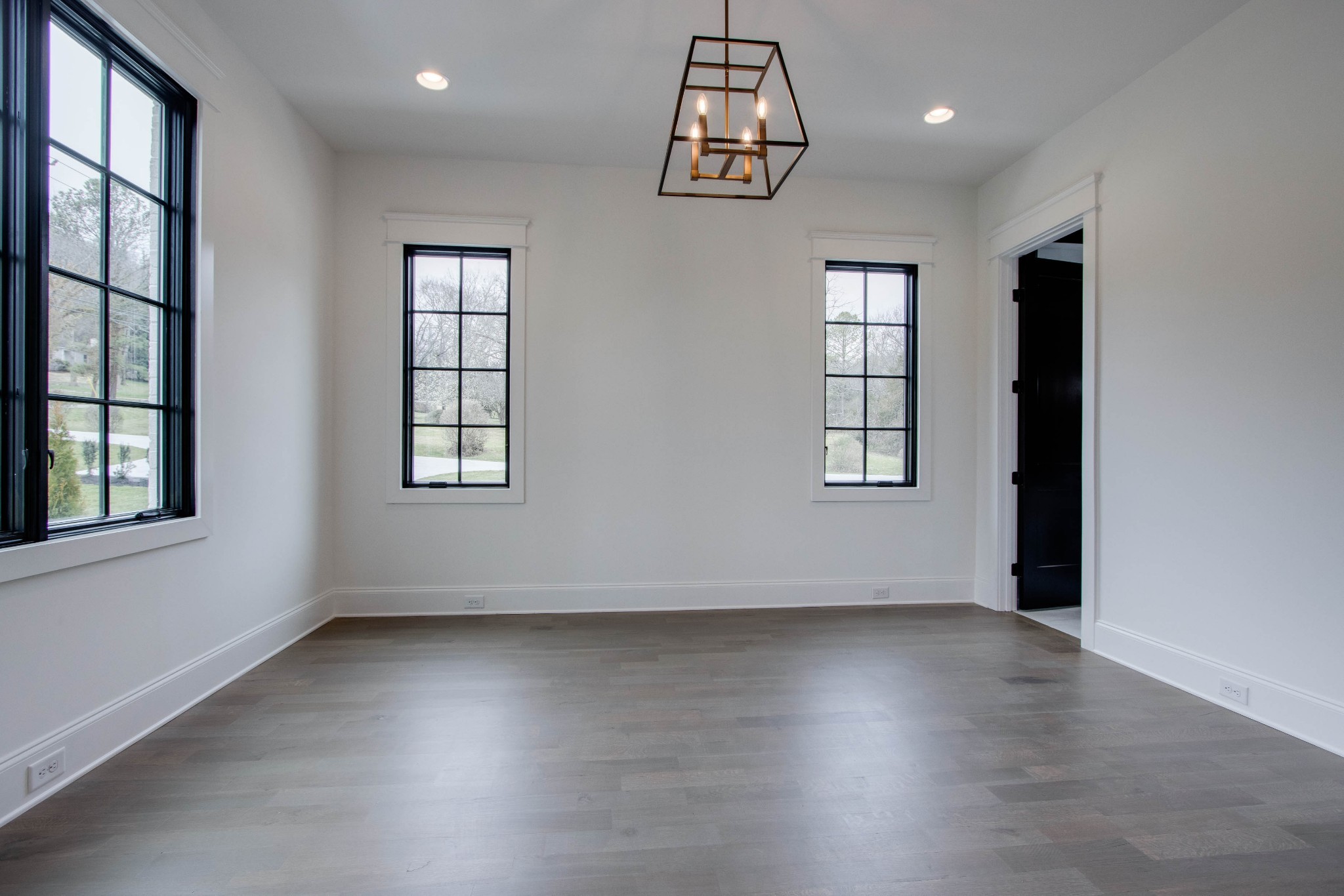 1300 Harding Place Nashville, TN 37215 - Photo 50 of 68 an empty room with wooden floor chandelier and windows