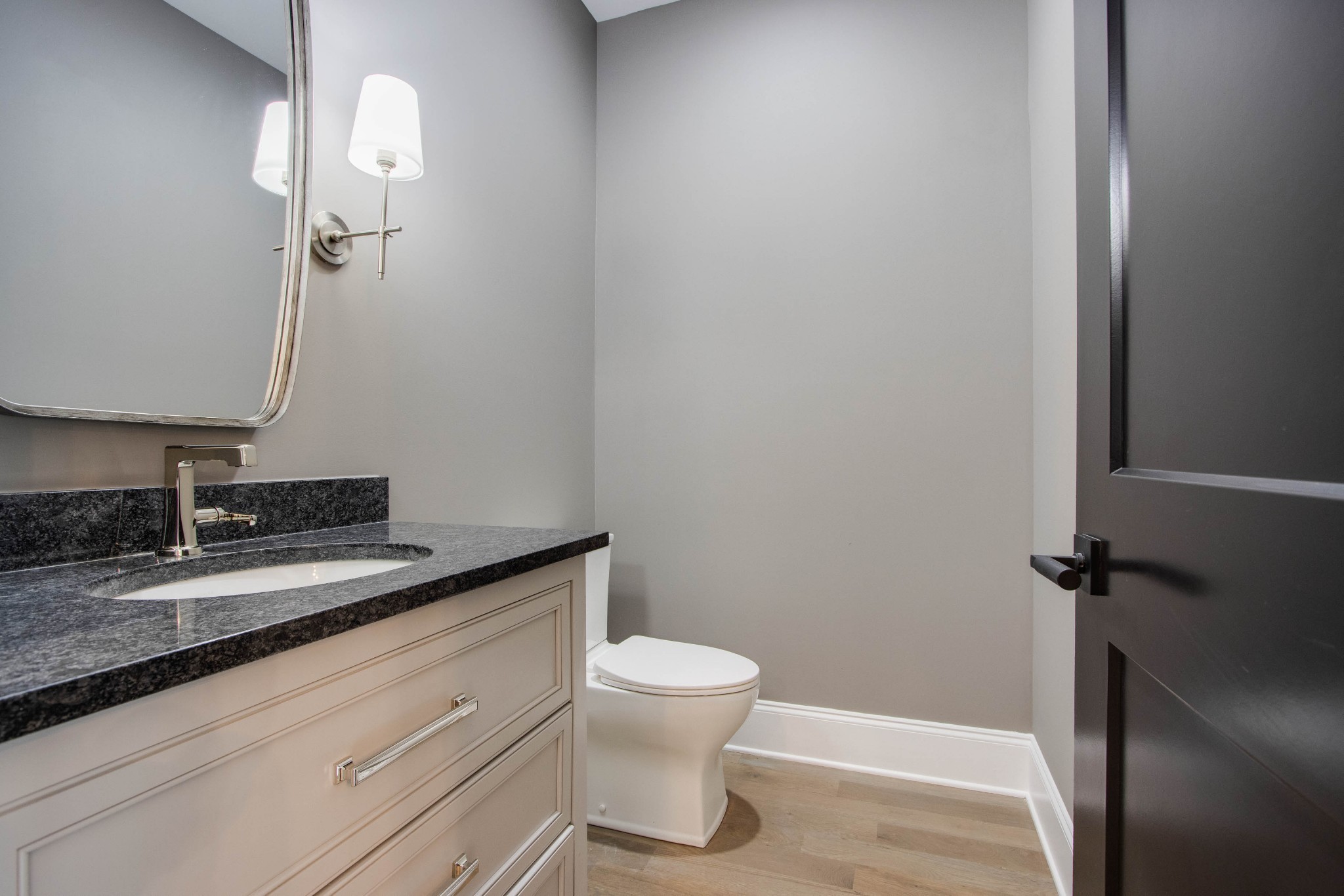 1300 Harding Place Nashville, TN 37215 - Photo 53 of 68 a bathroom with a granite countertop sink toilet and a mirror