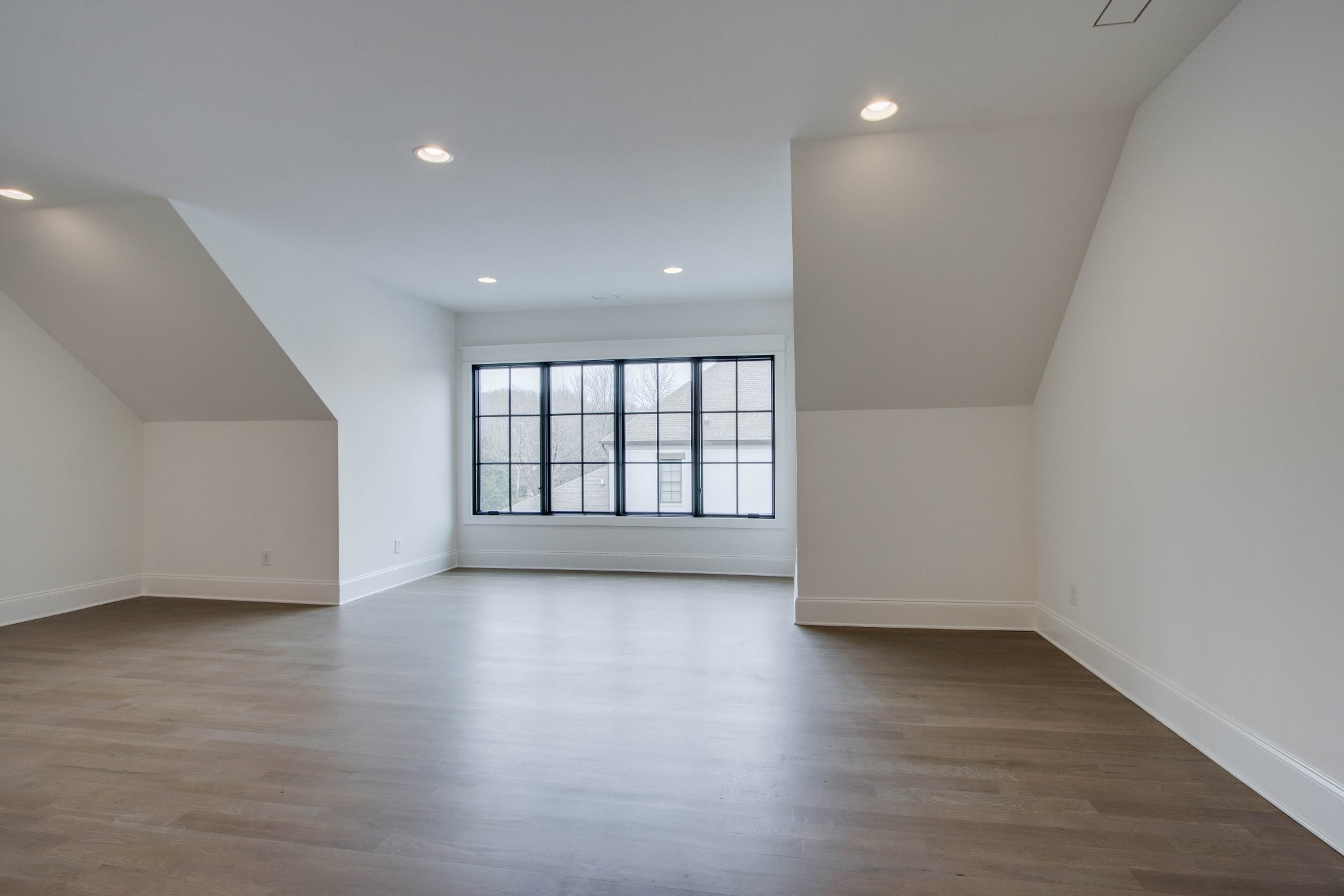 1300 Harding Place Nashville, TN 37215 - Photo 54 of 68 an empty room with wooden floor and windows