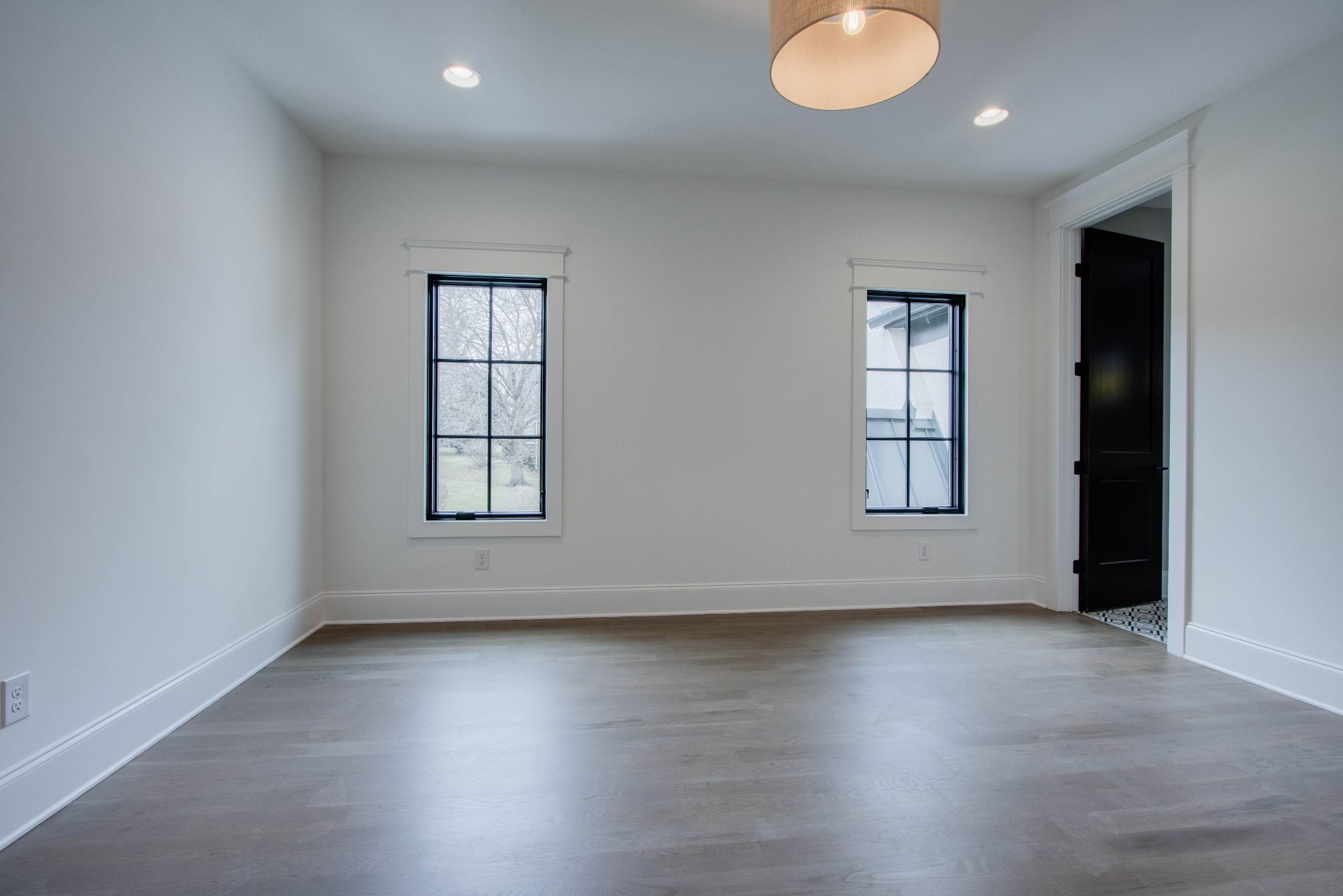 1300 Harding Place Nashville, TN 37215 - Photo 56 of 68 an empty room with wooden floor and windows