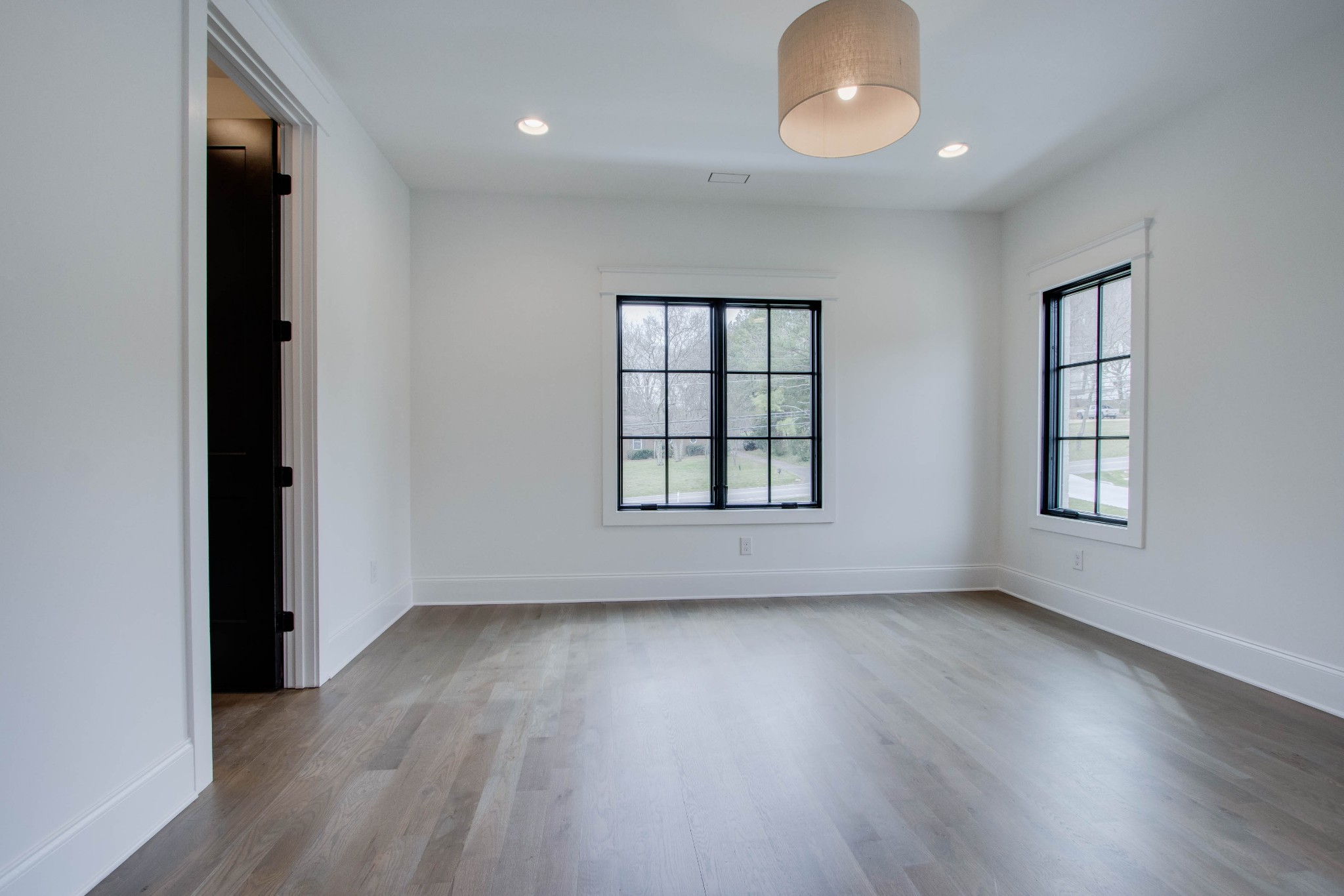 1300 Harding Place Nashville, TN 37215 - Photo 59 of 68 an empty room with wooden floor and windows