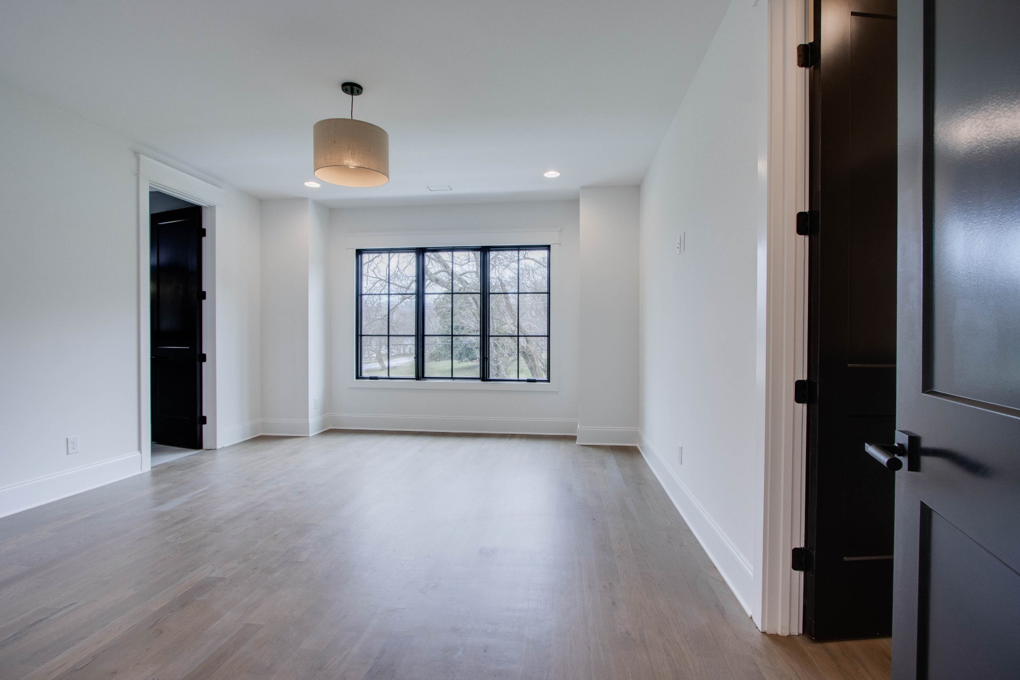 1300 Harding Place Nashville, TN 37215 - Photo 60 of 68 wooden floor in an empty room with a window