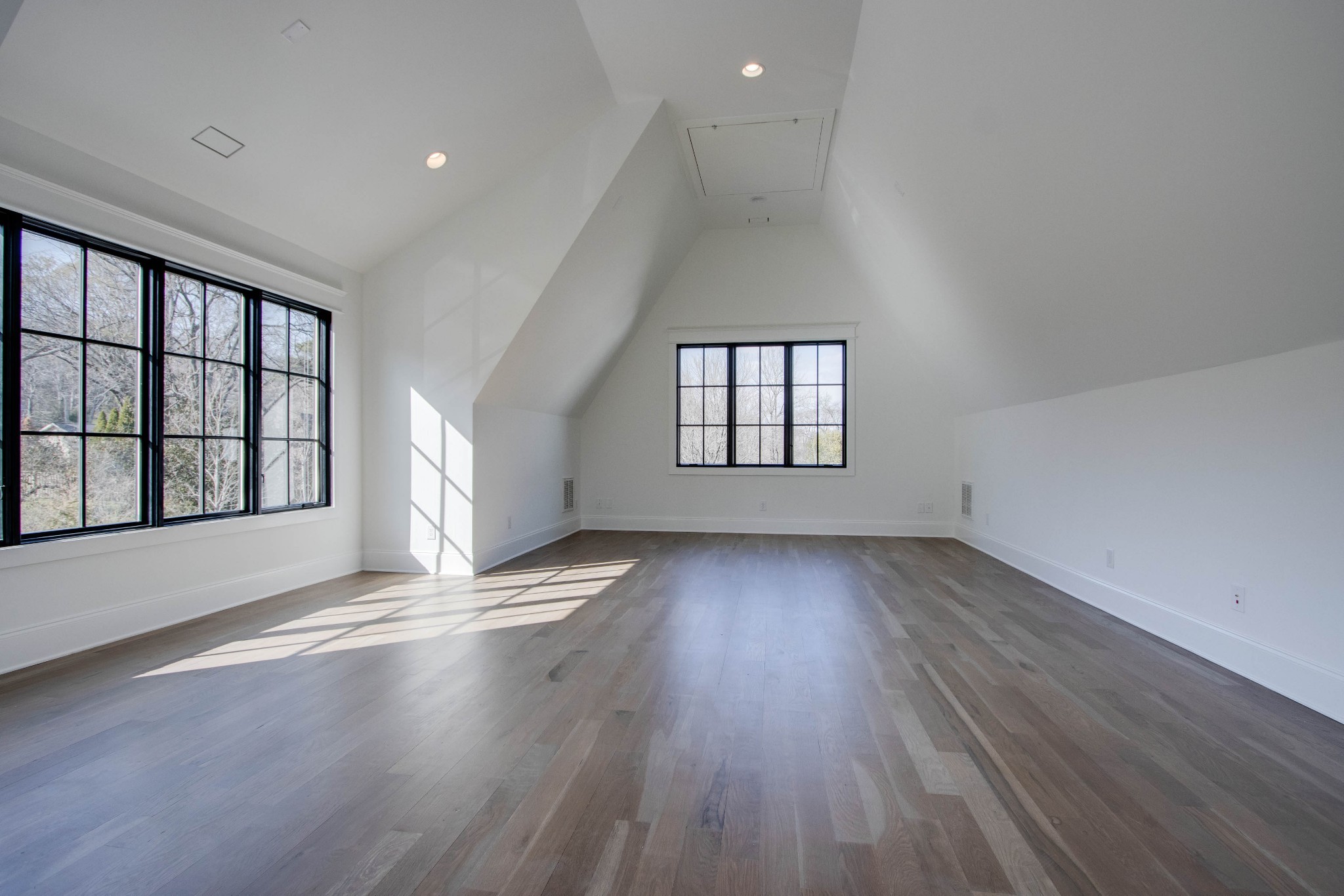 1300 Harding Place Nashville, TN 37215 - Photo 62 of 68 an empty room with wooden floor and windows