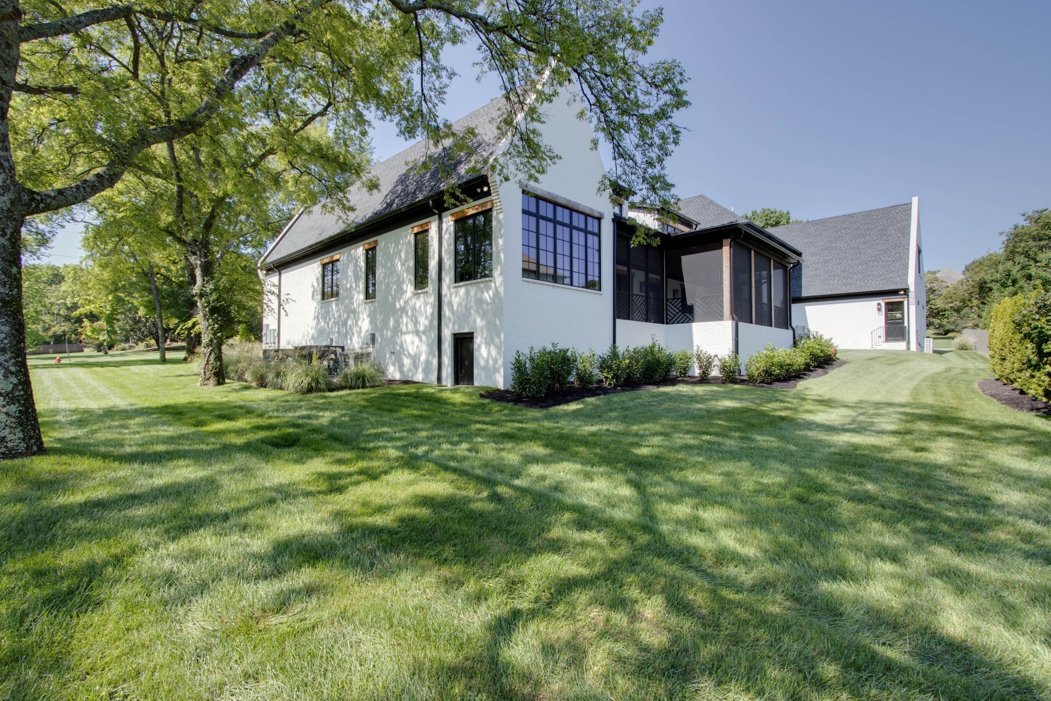 1300 Harding Place Nashville, TN 37215 - Photo 7 of 68 a front view of a house with a yard