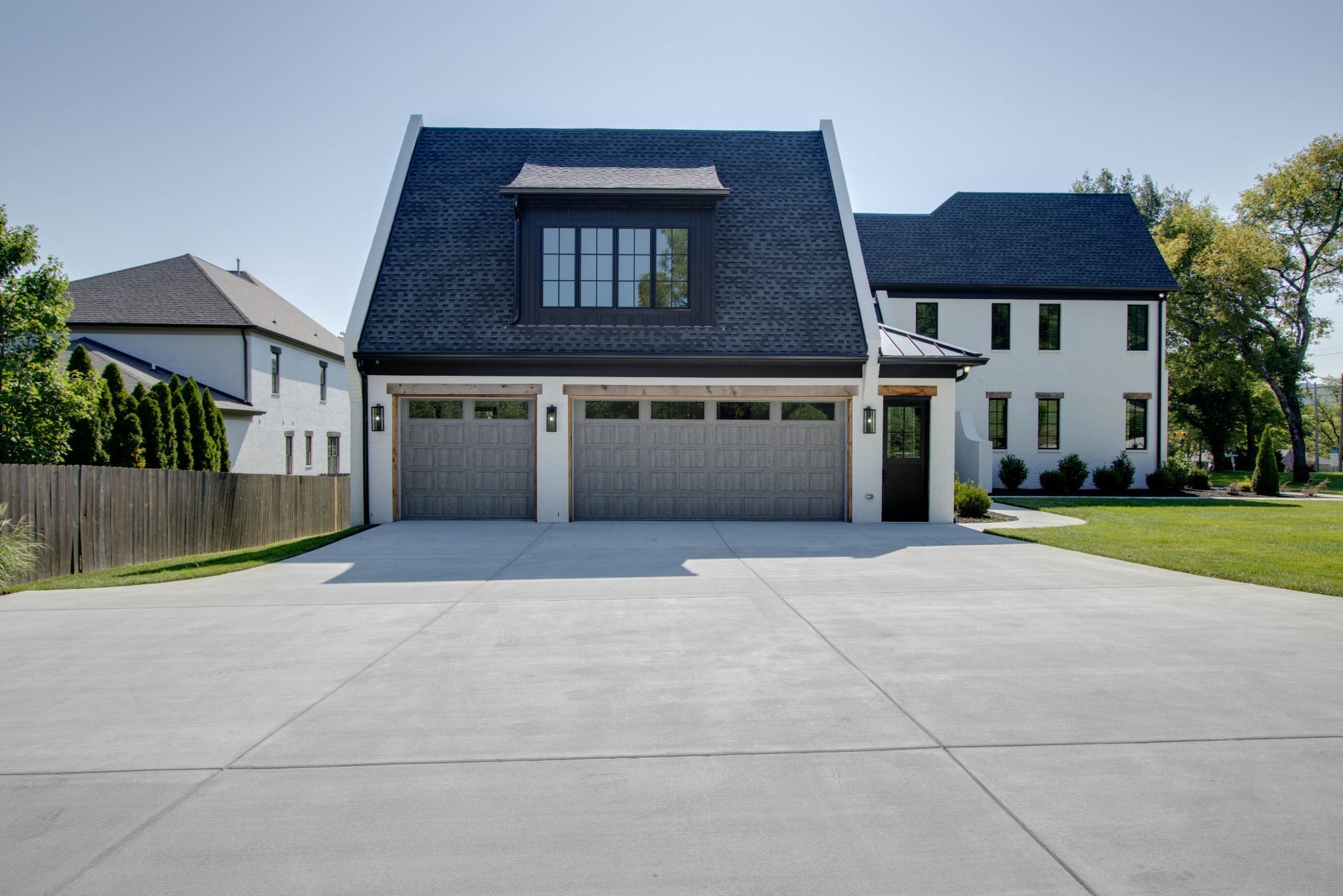 1300 Harding Place Nashville, TN 37215 - Photo 9 of 68 a front view of a house with a yard and garage