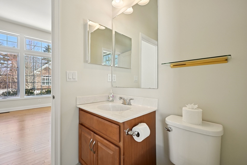 17 West View Lane, Unit 17 Stow, MA 01775 - Photo 14 of 32 a bathroom with a sink and a mirror