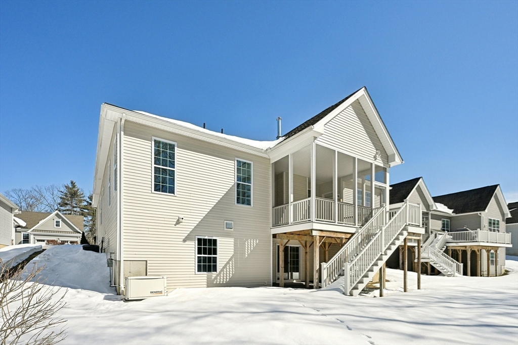 17 West View Lane, Unit 17 Stow, MA 01775 - Photo 15 of 32 a view of a house with wooden stairs