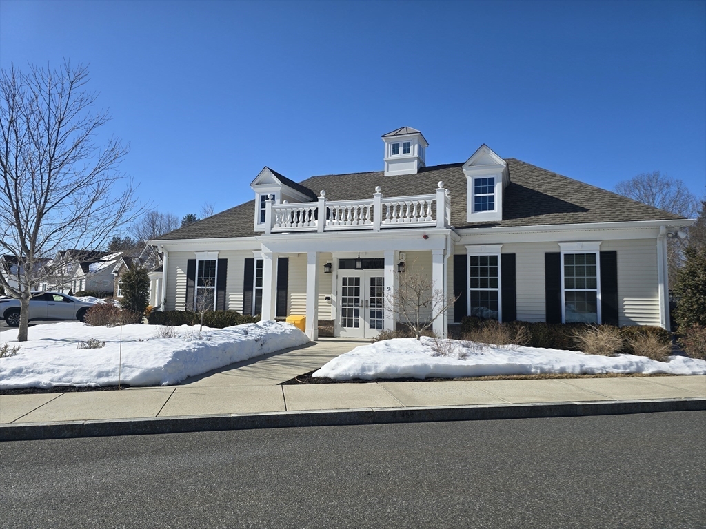 17 West View Lane, Unit 17 Stow, MA 01775 - Photo 26 of 32 a front view of a house with a yard