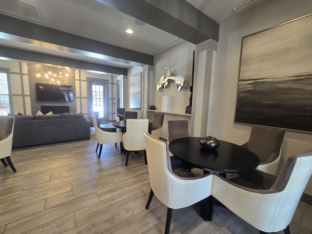 17 West View Lane, Unit 17 Stow, MA 01775 - Photo 29 of 32 a living room with furniture and a flat screen tv