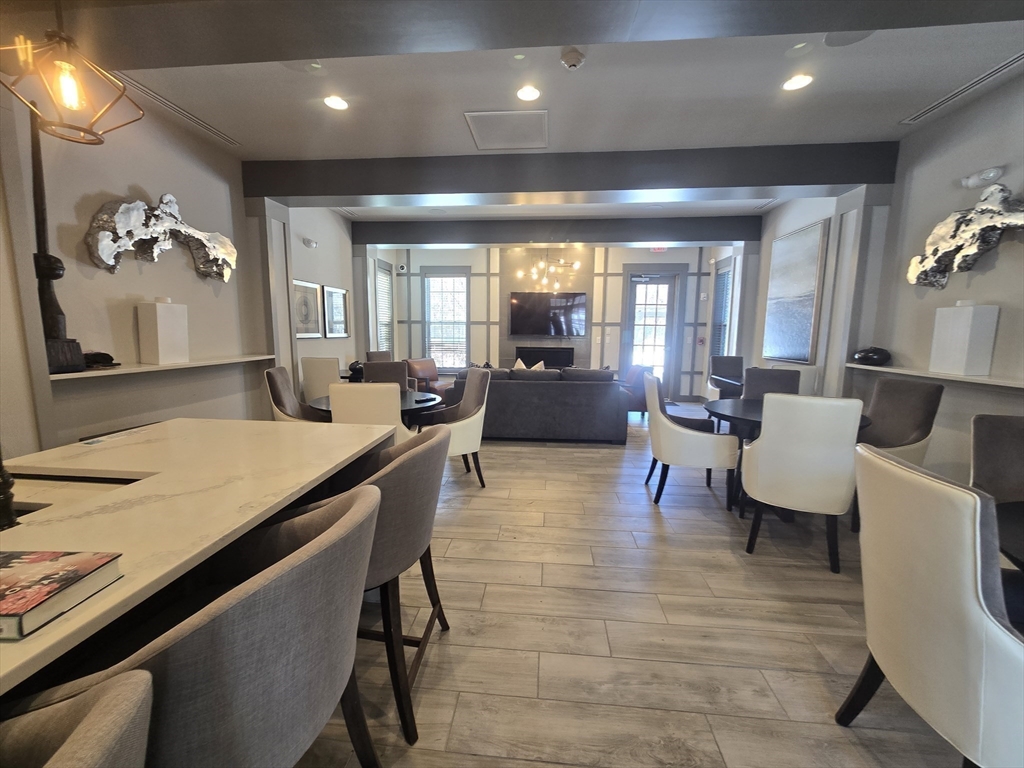 17 West View Lane, Unit 17 Stow, MA 01775 - Photo 30 of 32 a lobby with furniture and window
