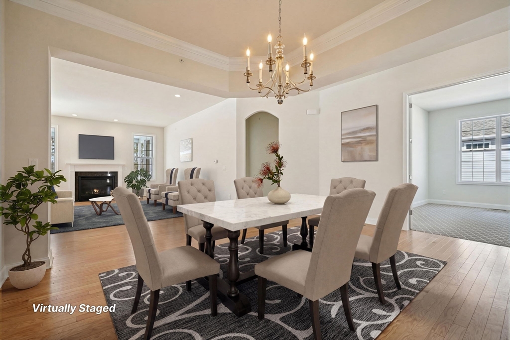 17 West View Lane, Unit 17 Stow, MA 01775 - Photo 3 of 32 a view of a dining room with furniture window and wooden floor