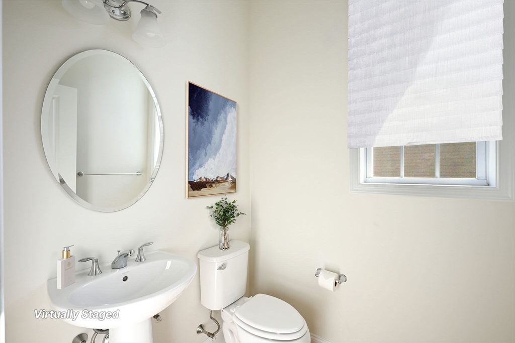 17 West View Lane, Unit 17 Stow, MA 01775 - Photo 8 of 32 a bathroom with a sink mirror and toilet