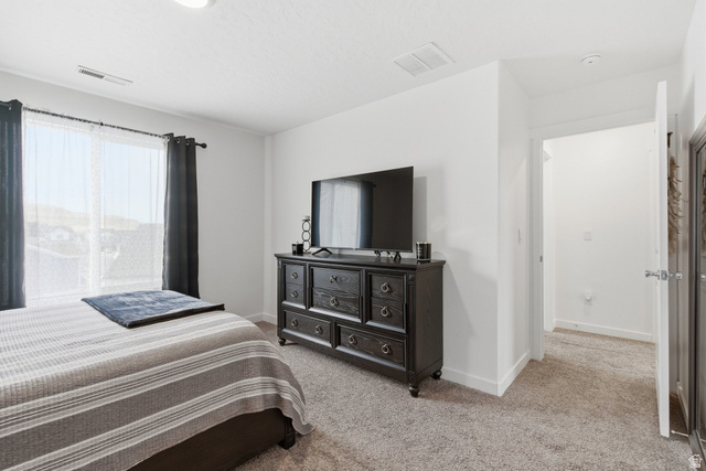 3808 Galatia Road Magna, UT 84044 - Photo 31 of 59 Bright interior space featuring light-colored walls and soft carpet flooring