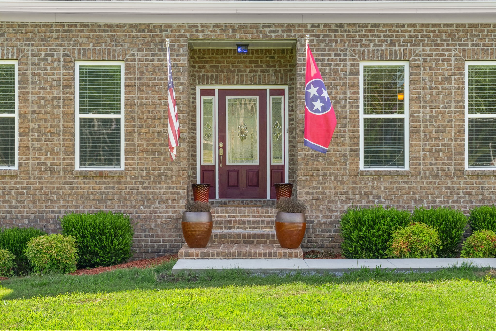 4940 Marion Road Cunningham, TN 37052 - Photo 3 of 43 a front view of a house with garden