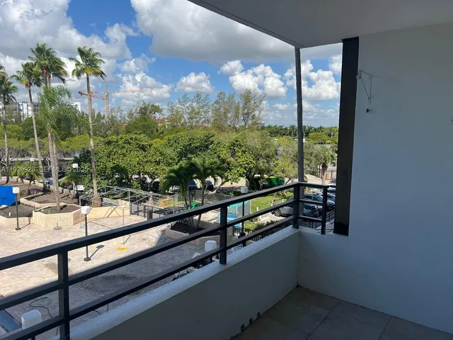 a view of swimming pool from a balcony