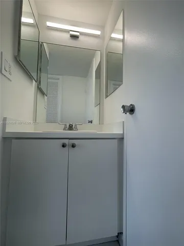a bathroom with a shower and a bath tub