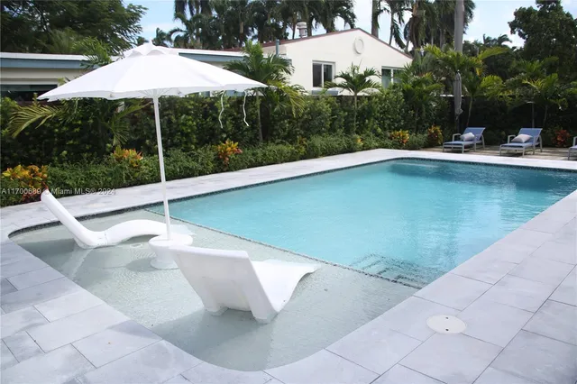 a front view of a house with a garage