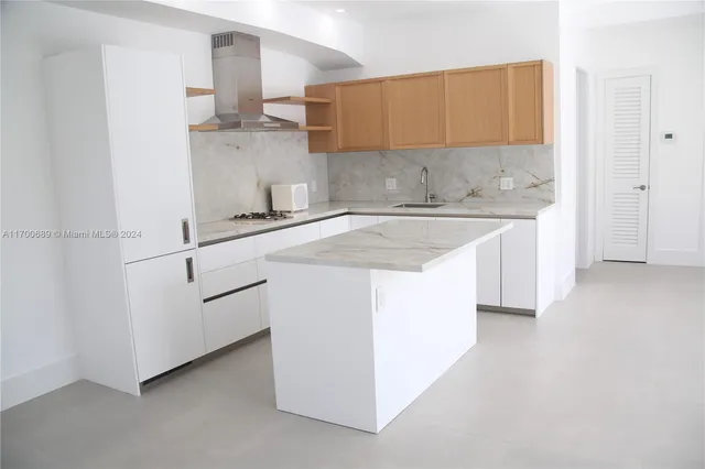 a front view of a house with a yard and a garage