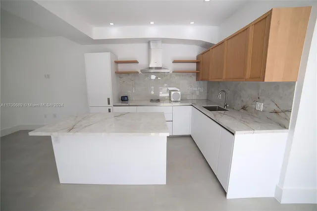 a bathroom with a toilet sink and shower