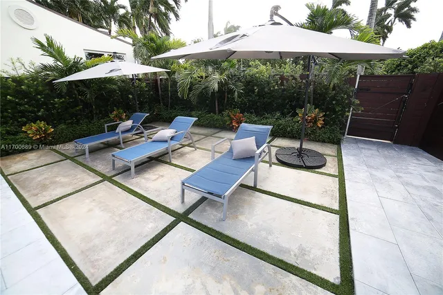 an empty room with wooden floor and fireplace
